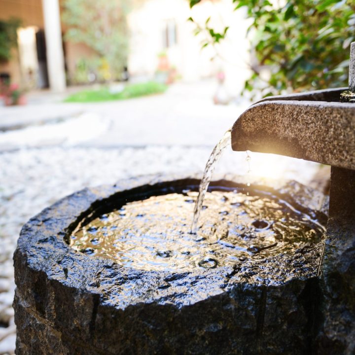 Traditional spring water fountain in garden
